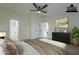 Virtually staged main bedroom with ensuite bathroom access at 9144 E Balsam Ave, Mesa, AZ 85208