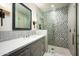 Modern bathroom with patterned tile, vanity, and a large shower at 9820 E Thompson Peak Pkwy # 646, Scottsdale, AZ 85255