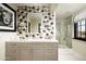 Spa-like bathroom with a unique scale patterned wall at 9820 E Thompson Peak Pkwy # 646, Scottsdale, AZ 85255