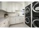 Bright laundry room features stacked washer/dryer and ample counter space at 9820 E Thompson Peak Pkwy # 646, Scottsdale, AZ 85255