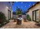 Brick patio with fire pit and string lights at 9820 E Thompson Peak Pkwy # 646, Scottsdale, AZ 85255