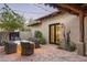 Brick patio with string lights and wicker furniture at 9820 E Thompson Peak Pkwy # 646, Scottsdale, AZ 85255