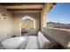 Outdoor patio with arched openings, mountain views and seating area at 9820 E Thompson Peak Pkwy # 646, Scottsdale, AZ 85255