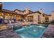 Expansive pool and spa with stonework and lounge chairs at 9820 E Thompson Peak Pkwy # 646, Scottsdale, AZ 85255