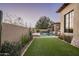 Landscaped backyard with artificial turf and pool at 9820 E Thompson Peak Pkwy # 646, Scottsdale, AZ 85255