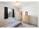 Cozy bedroom featuring natural light, neutral carpet, and simple furnishings at 10136 E Southern Ave # 1045, Mesa, AZ 85209