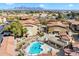 Aerial view of a refreshing community pool with lounge chairs and a pergola at 10136 E Southern Ave # 1045, Mesa, AZ 85209