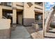 An exterior shot highlighting a walkway to the entrance of the condo complex with landscaping at 10136 E Southern Ave # 1045, Mesa, AZ 85209