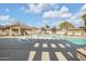 Community pool and spa with surrounding lounge chairs at 10136 E Southern Ave # 1045, Mesa, AZ 85209