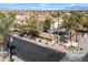 Street view of the apartment complex's entrance, palm trees, and parking lot at 10136 E Southern Ave # 1045, Mesa, AZ 85209