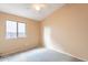 Well-lit bedroom with ceiling fan and neutral decor at 10512 E Dutchmans Trl, Gold Canyon, AZ 85118