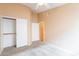 Bright bedroom with double door closet and carpet flooring at 10512 E Dutchmans Trl, Gold Canyon, AZ 85118