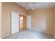 Bright bedroom with ceiling fan and carpet flooring at 10512 E Dutchmans Trl, Gold Canyon, AZ 85118