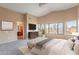 Main bedroom with plush carpeting, large windows, and an ensuite bathroom at 10512 E Dutchmans Trl, Gold Canyon, AZ 85118