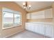 Well-lit dining area, featuring white cabinets and large window at 10512 E Dutchmans Trl, Gold Canyon, AZ 85118