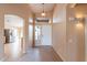 Bright and airy entryway with tile flooring and views into the kitchen and living areas at 10512 E Dutchmans Trl, Gold Canyon, AZ 85118