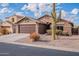 One story home with a two car garage and desert landscaping at 10512 E Dutchmans Trl, Gold Canyon, AZ 85118