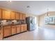 Kitchen with wood cabinets, granite countertops, and stainless steel appliances at 10512 E Dutchmans Trl, Gold Canyon, AZ 85118