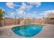 Clear blue pool, surrounded by a landscaped backyard and mountains at 10512 E Dutchmans Trl, Gold Canyon, AZ 85118