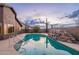 Private backyard pool with a rock waterfall feature at 10512 E Dutchmans Trl, Gold Canyon, AZ 85118