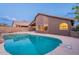 Inviting kidney-shaped pool, showcasing the home's exterior at 10512 E Dutchmans Trl, Gold Canyon, AZ 85118