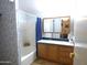 Bathroom with a bathtub, vanity, and mirrored medicine cabinet at 106 S 72Nd Way, Mesa, AZ 85208