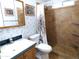 Bathroom with shower/tub combo, tile walls, and a vanity at 106 S 72Nd Way, Mesa, AZ 85208