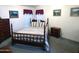 Bedroom with a wooden bed frame and matching nightstand at 106 S 72Nd Way, Mesa, AZ 85208