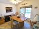 Dining area with wood table and chairs, and a large window at 106 S 72Nd Way, Mesa, AZ 85208