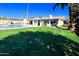 Spacious backyard with pool, grass, and patio at 10618 N 27Th St, Phoenix, AZ 85028