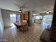 Dining area with wood hutch and view into kitchen at 10618 N 27Th St, Phoenix, AZ 85028