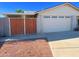 Attached two-car garage with double doors and side gate at 10618 N 27Th St, Phoenix, AZ 85028