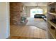 Living room with brick fireplace and leather sofa at 10618 N 27Th St, Phoenix, AZ 85028