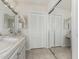 Bright bathroom with double sinks, linen closet and mirrored closet at 11009 W Crestbrook Dr, Sun City, AZ 85351