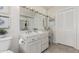 Bathroom featuring a vanity with a large mirror and a toilet at 11009 W Crestbrook Dr, Sun City, AZ 85351