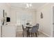 Small breakfast nook with glass table and gray chairs at 11009 W Crestbrook Dr, Sun City, AZ 85351