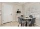 Small breakfast nook with glass table and gray chairs at 11009 W Crestbrook Dr, Sun City, AZ 85351