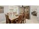 Bright dining room with wooden table and chairs, and built-in hutch at 11009 W Crestbrook Dr, Sun City, AZ 85351