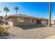 Single-story home with a two-car garage and desert landscaping at 11009 W Crestbrook Dr, Sun City, AZ 85351