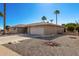 Single story home with a two-car garage and rock landscaping at 11009 W Crestbrook Dr, Sun City, AZ 85351