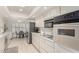 Modern kitchen with stainless steel appliances and light cabinets at 11009 W Crestbrook Dr, Sun City, AZ 85351