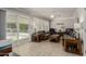 Sun-drenched living room with sliding doors leading to a patio at 11009 W Crestbrook Dr, Sun City, AZ 85351