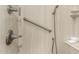 Walk-in shower with grab bars and modern fixtures at 11009 W Crestbrook Dr, Sun City, AZ 85351