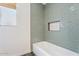 Clean bathroom showcasing a tiled shower, tiled walls, and a modern bathtub at 11802 S Half Moon Dr, Phoenix, AZ 85044