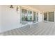 Charming covered patio featuring patterned tile, outdoor furniture, and a decorative lizard at 11802 S Half Moon Dr, Phoenix, AZ 85044