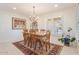 Bright dining room with neutral paint, tile floors, a window, and a decorative rug at 11802 S Half Moon Dr, Phoenix, AZ 85044