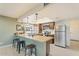 Kitchen with wood cabinets, a breakfast bar, and stainless steel appliances at 11802 S Half Moon Dr, Phoenix, AZ 85044