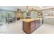 Open-concept kitchen featuring wood cabinets, a cozy eating area, and stainless steel appliances at 11802 S Half Moon Dr, Phoenix, AZ 85044