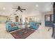 The living room features bright natural light, tile floors, with views of the dining area at 11802 S Half Moon Dr, Phoenix, AZ 85044