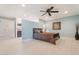 Spacious main bedroom featuring a ceiling fan and ensuite bathroom entrance at 11802 S Half Moon Dr, Phoenix, AZ 85044